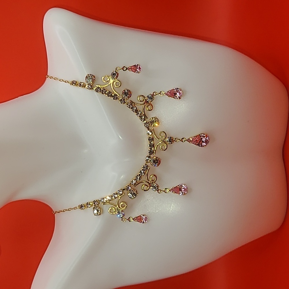 Necklace with gold color and faux stones looks very princess like